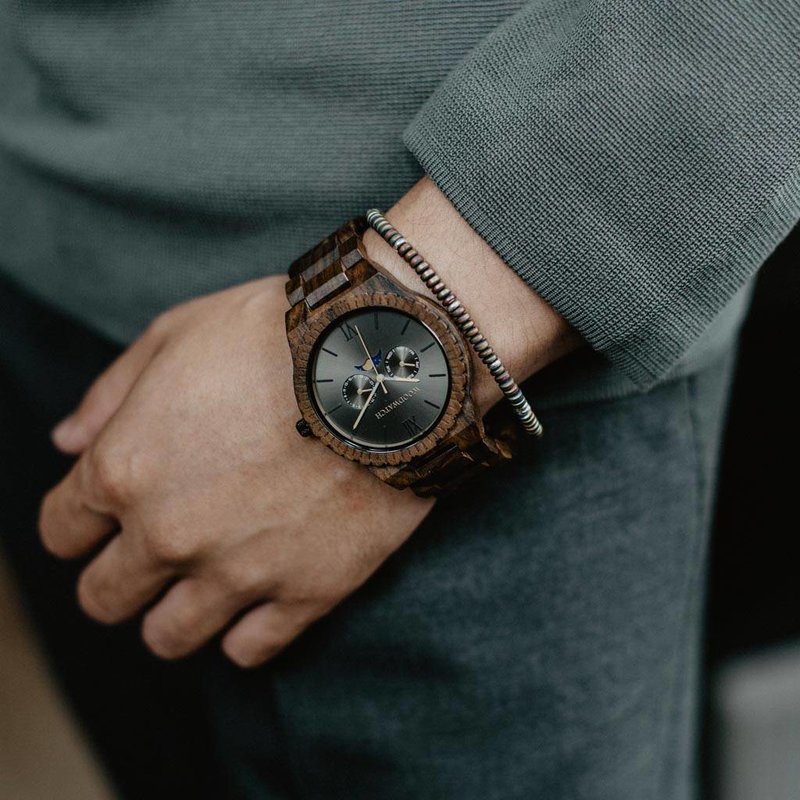 This premium designed watch with moon phase, combines unique new wood types with a luxurious stainless steel dial and backplate. At the heart of the timepiece comes an all new multi-function movement that includes two extra subdials featuring a week and m